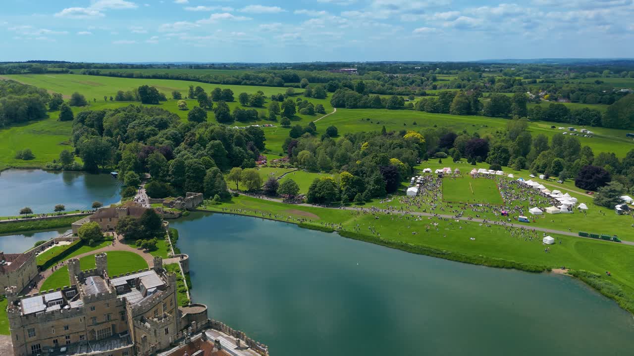 Lances clash and banners fly, crowds cheer loud beneath the blue sky