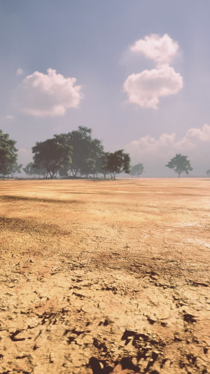 Barren landscape under a vast sky with scattered clouds at midday