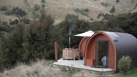 glamping cabin with hot tub in a scenic landscape