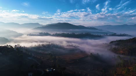 misty mountain village at sunrise