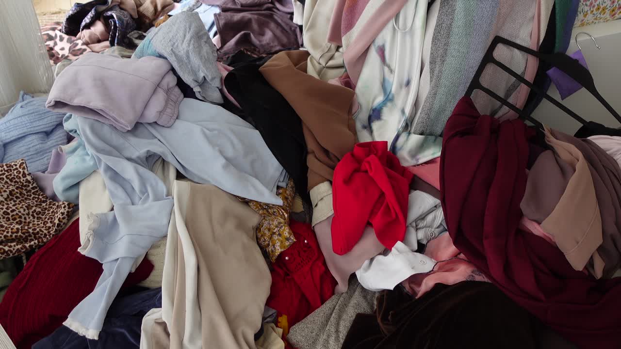 Large Pile of Messy Clothes and Laundry on the Floor