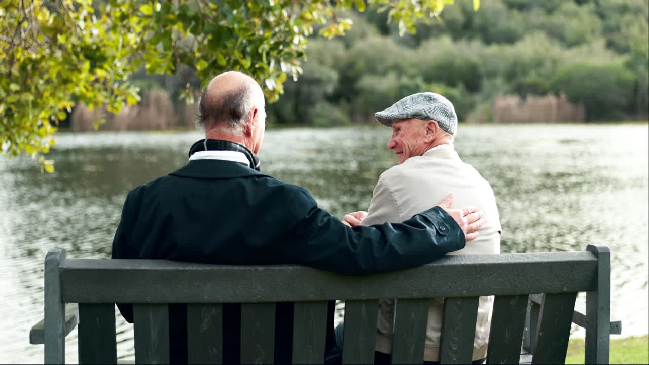 Two Elderly Men Enjoying Each Other's Company by the Lake