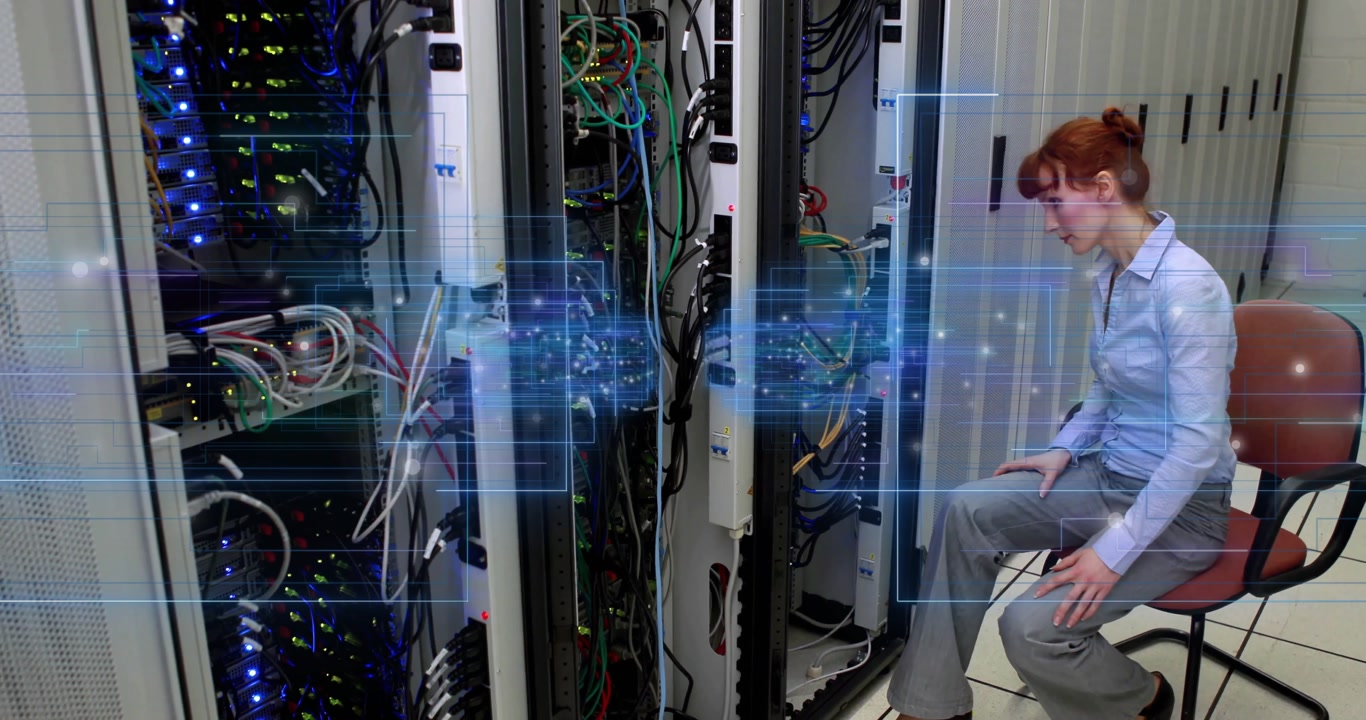 Female technician sitting by server racks activating holographic network UI for network diagnostics