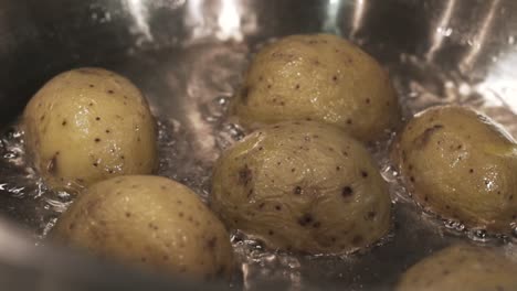 boiling potatoes in a pan