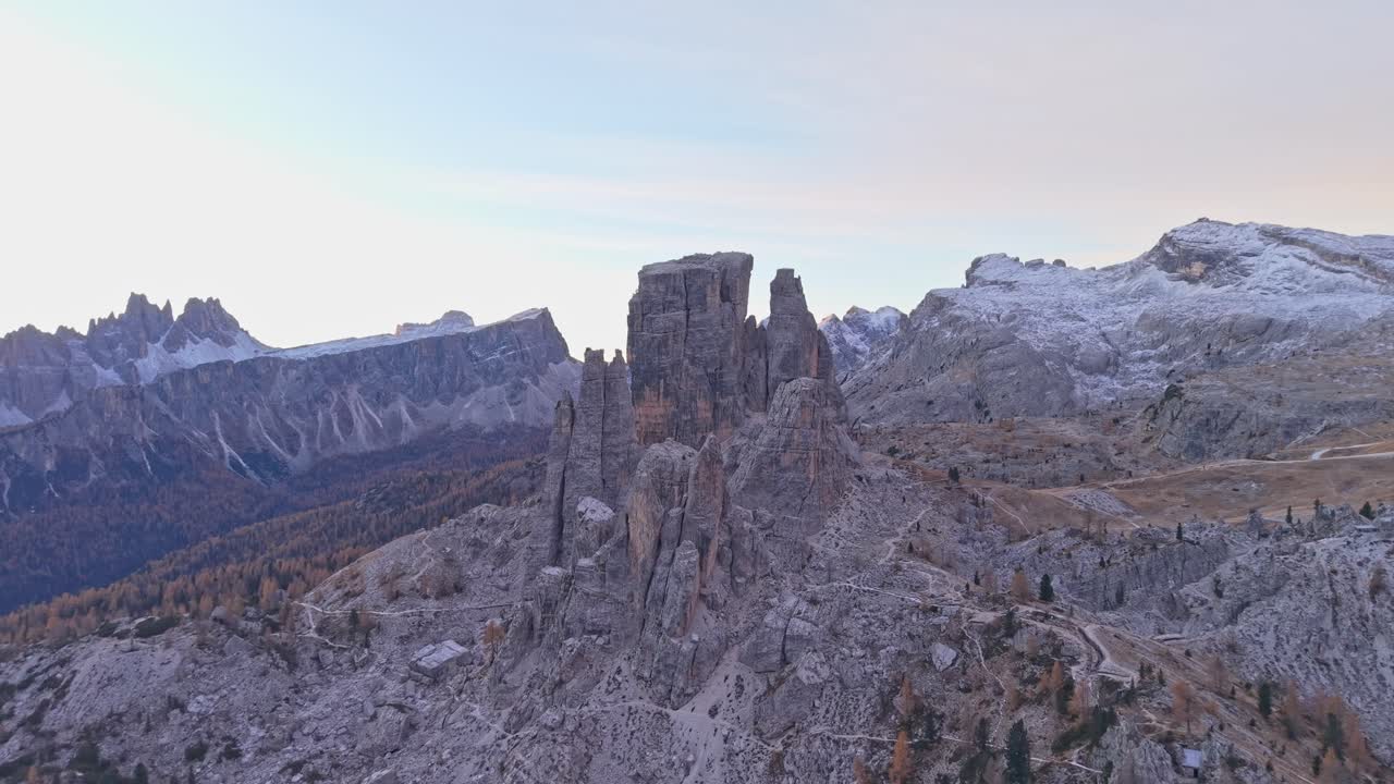 Aerial sunrise over Cinque Torri and Cortina d'Ampezzo in autumn, Italy
