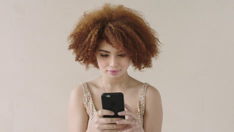 young beautiful mixed race woman portrait smiling using phone texting