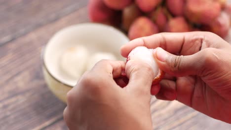taking skin off a lychee top down