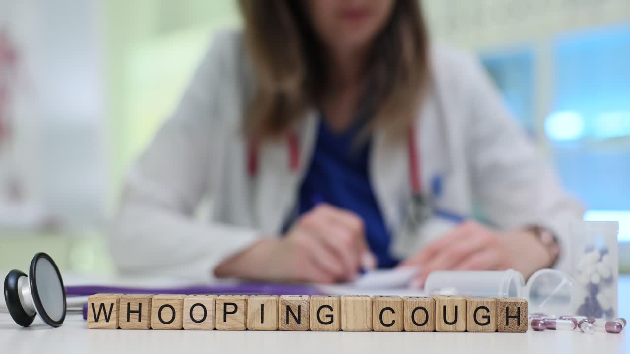 Medical professional with 'WHOOPING COUGH' text blocks and medical supplies