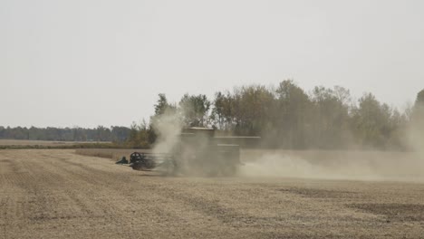 Farmer-In-Combine-Harvester-Tractor-During-Harvesting-Season