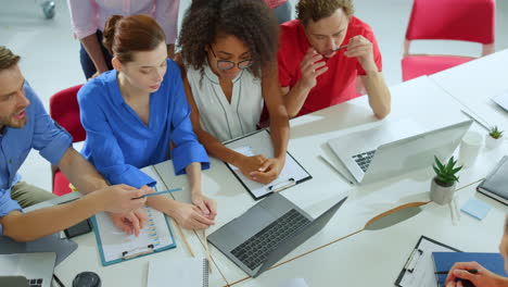 Business-people-working-computer-office.-Creative-people-looking-laptop-screen.