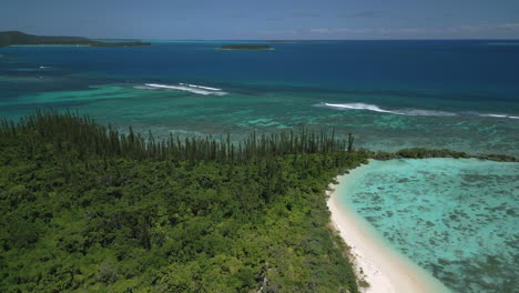 ilot moro a small island is part of the archipelago of the isle of pines in new caledonia - aerial tilt down flyover