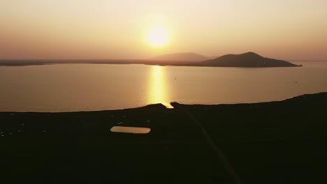 breathtaking sunset over thai mountains aerial view of tranquil water surface and orange glow