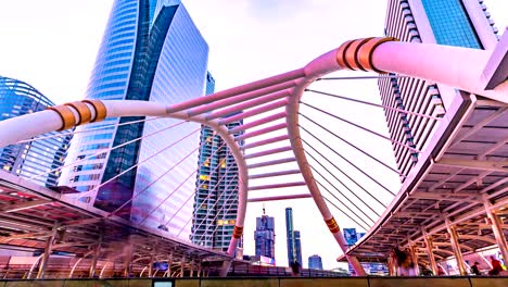 cinemagraph 4k resolution, cityscape bangkok downtown day to night, the center business background, show lighting on modern bridge of communication concept. abstract background with hrd effect filter.