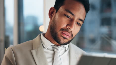 businessman looking at a tablet