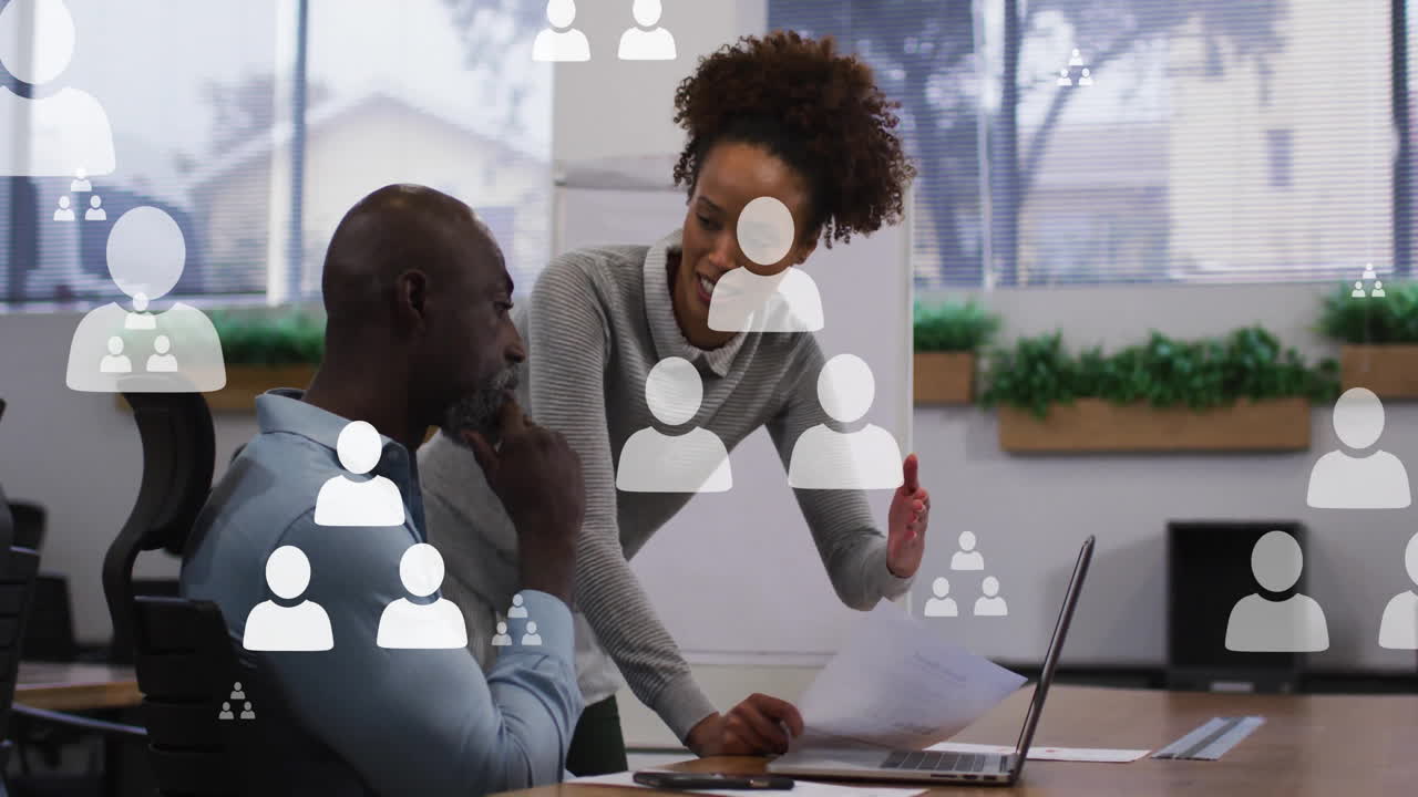 Animation of people icons and data processing over diverse business people in office