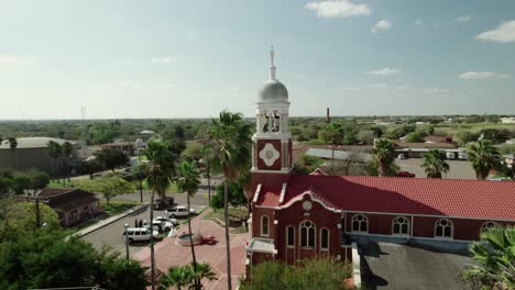 Aerial-view-of-"Our-Lady-of-Guadalup"-Church,-one-of-the-oldest-landmarks-in-Mission,-Texas