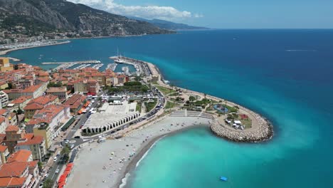 Jean-Cocteau-museum-and-parks-at-the-western-shore-of-Menton-France-near-the-Mediterranean-ocean,-Aerial-dolly-out-shot