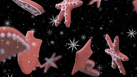 animation of christmas gingerbread cookies over snowflakes falling on black background