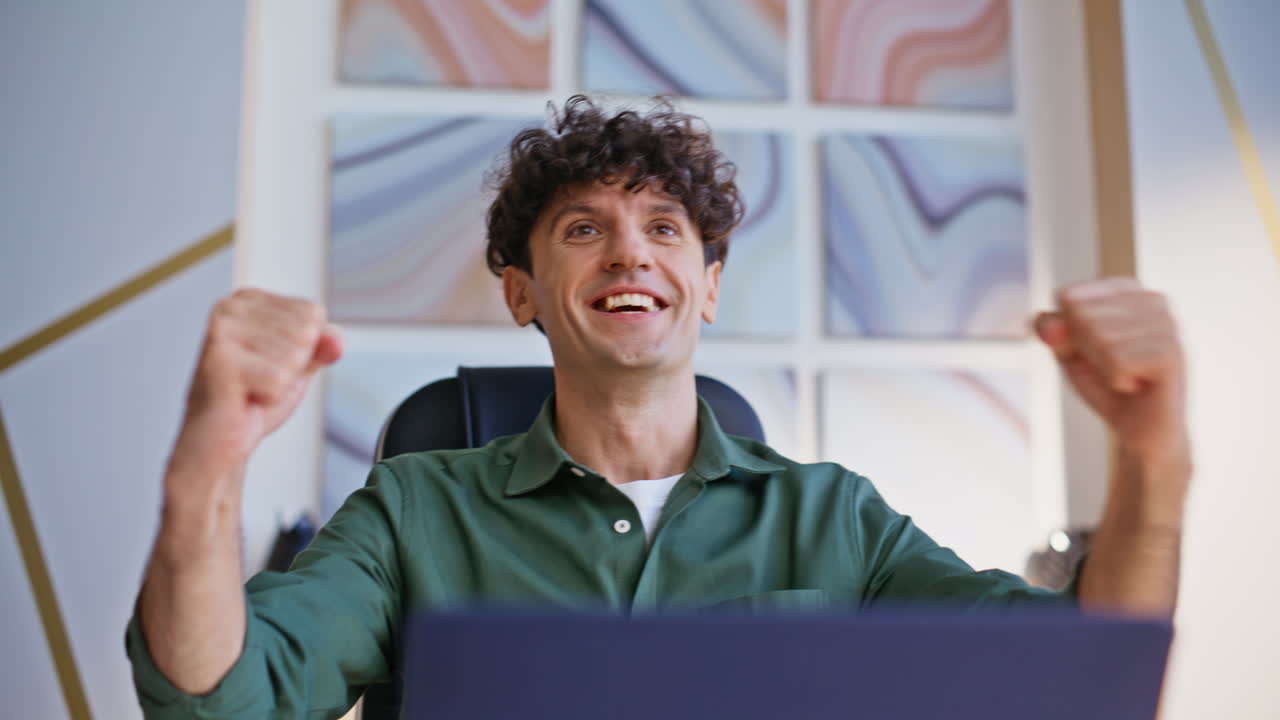 Emotional businessman rejoicing success working with documents in office closeup