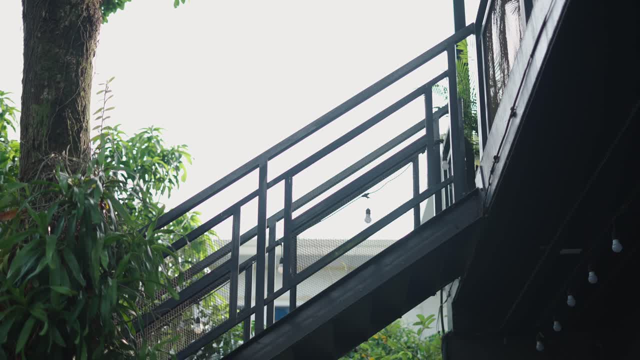 Girl Walking Upstairs at a Cafe