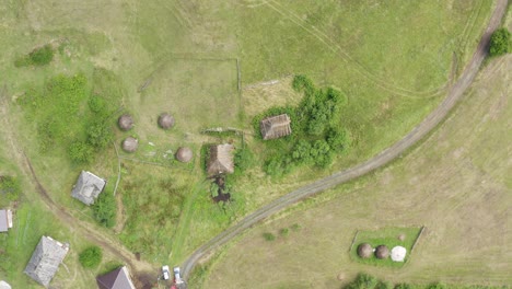 Aerial-Top-View-Of-Old-Roofs-On-Old-Serbian-Houses-In-Sopotnica-Village-In-Serbia---aerial-descend