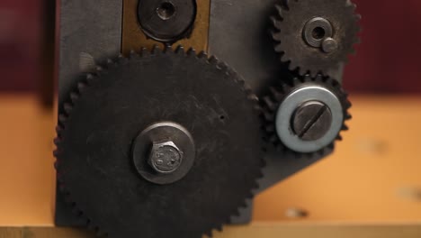 machine gears on jewelry rolling mill tool during work jeweler.