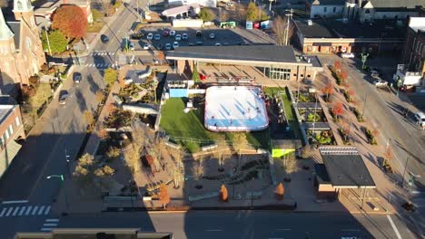 downtown commons winter ice rink on a sunny day in clarksvillecity in tennessee, usa