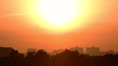 rising sun with silhouetted buildings, 4k resolution video.