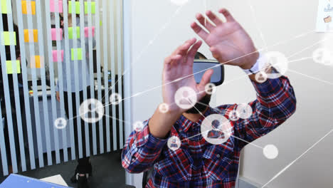 Animation-of-networks-of-connections-and-businessman-wearing-phone-vr-headset