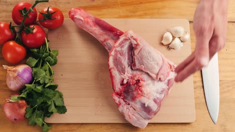preparing raw lamb leg