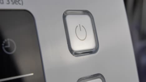 pressing stand by power button to turn on and off the device close-up