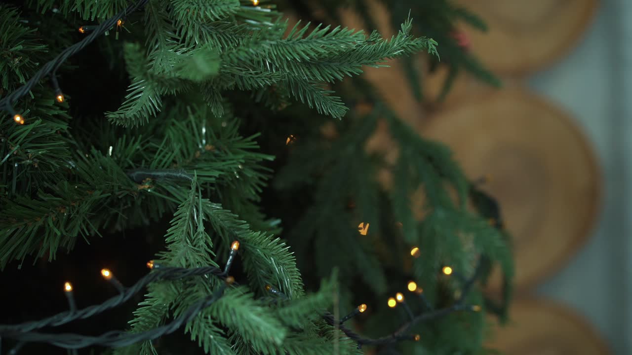 Hands Decorating a Christmas Tree