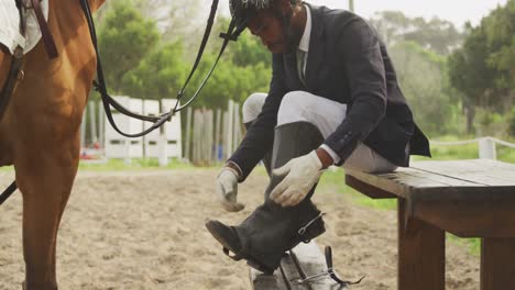 African-American-man-putting-on-his-gaiters