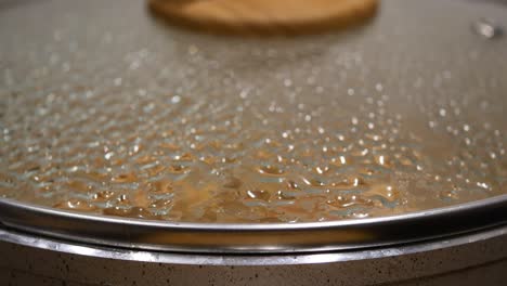 steam rising from a pot lid