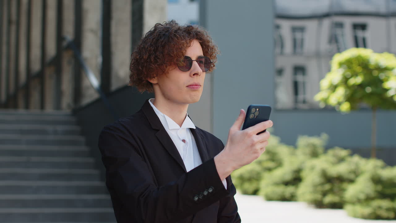 Businessman looking for location uses geolocation gps maps application on mobile phone find way road