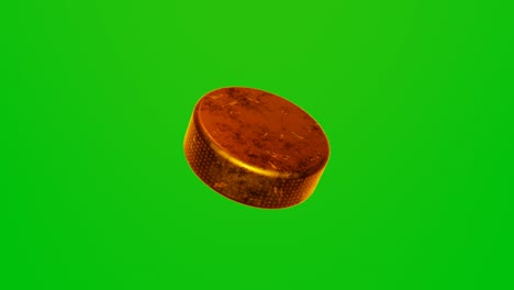 golden hockey puck on chromakey background.