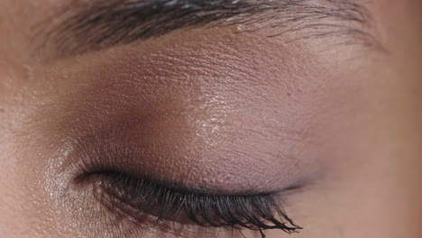 close-up-african-american-woman-eye-opening-blinking-looking-at-camera-iris-reflection