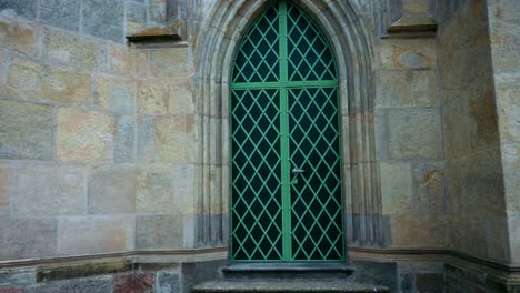 large church door with green fittings