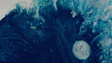 abstract of blue liquid flowing slowly between white circle color collision