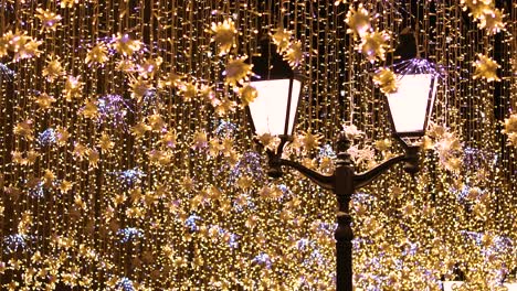 street lantern with decorative christmas garlands. new year and christmas celebration.