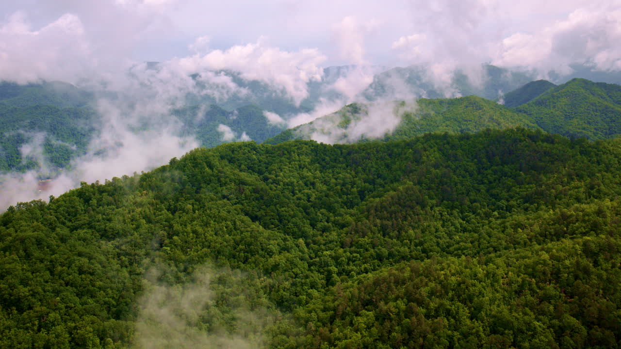 Epic drone flight over fog-filled Smoky Mountains.
