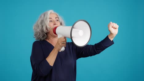 senior woman speaking through a megaphone