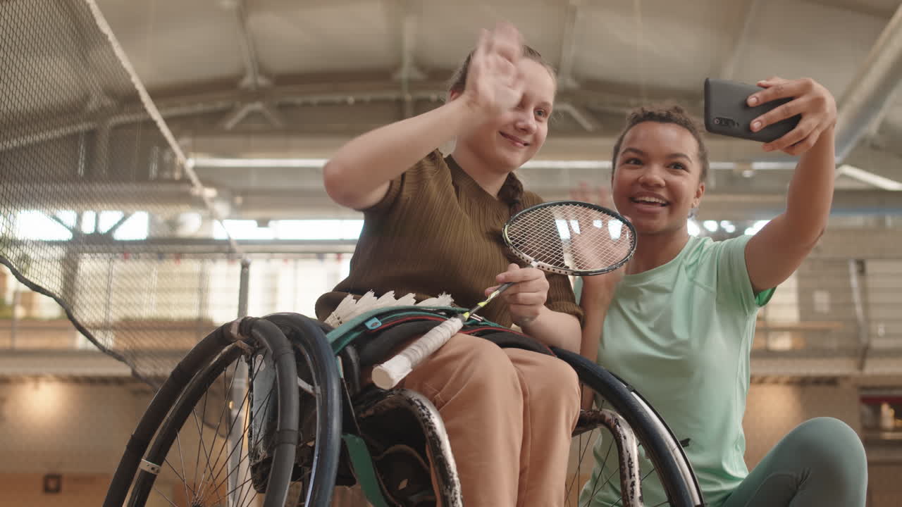 Woman Taking Selfie with Athlete in Wheelchair