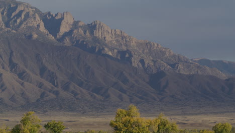 steady shot of the sandia mountains in albuquerque new mexico in the fall