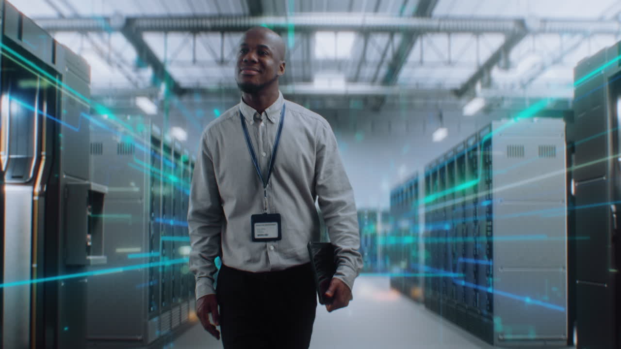 IT Professional Walking Through Modern Data Center with Digital Interface