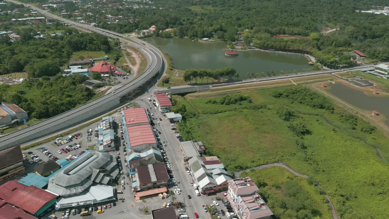 Aerial Drone View, Serian District Town ,Summer With Beautiful Green Trees,New Building And Water Park Lake, Water From The Mountain Sarawak,Borneo.
