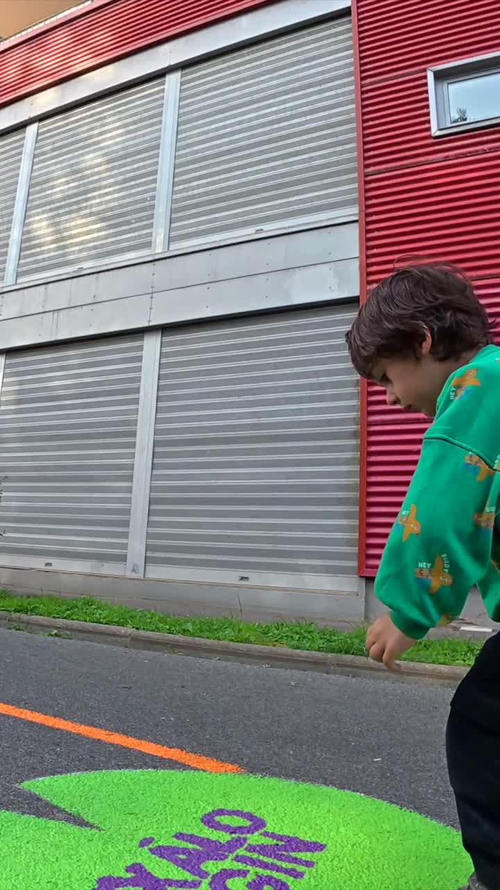 Child in front of a colorful building