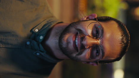 smiling man in glasses