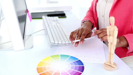 pretty designer working at her desk