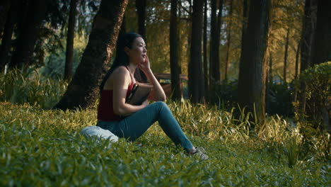 woman relaxing in a forest park